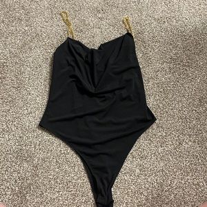 Gold and clack chain body suit
